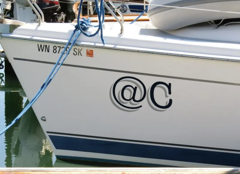 A docked boat named At C