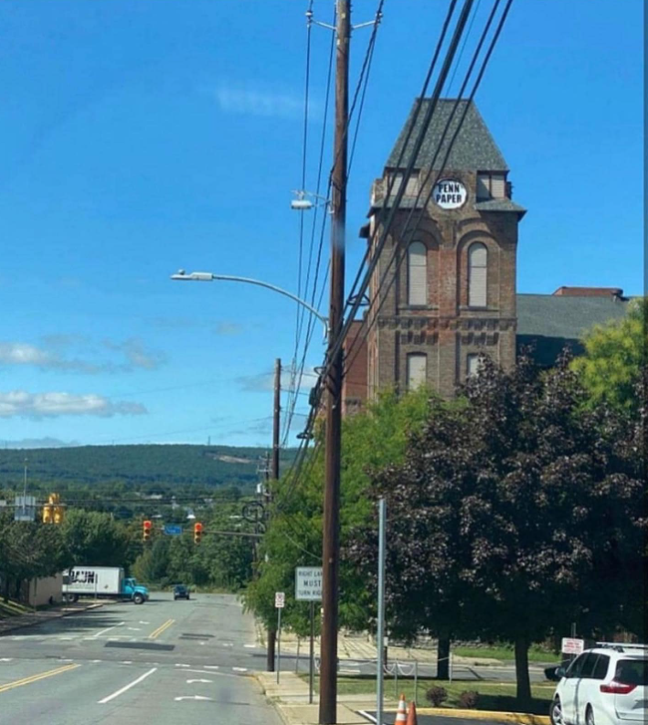 A brick tower building with a clock